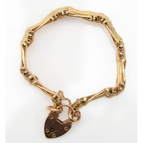 119 - A Victorian 9ct gold gate link bracelet with heart shaped padlock clasp, safety chain, 18cm, 16.3gm.