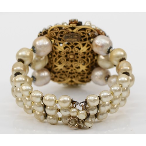 122 - A Miriam Haskell three strand faux baroque pearl and foil backed rhinestone floral bracelet, c.1950,... 