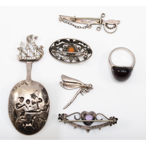 128 - Four Edwardian hallmarked silver brooches, and a ladies hallmarked silver ring, size P, together wit... 