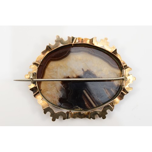 131 - A Victorian gold mounted agate brooch, with chased scroll border, unmarked, 58 x 42mm, 18gm, base me... 