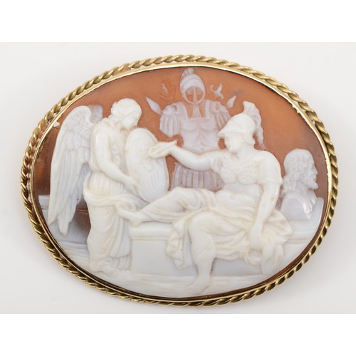 134 - An early 20th century 9ct gold shell carved cameo brooch, depicting Athena painting with an angel ho... 