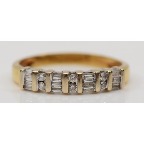 138 - An 18ct gold brilliant cut and baguette cut diamond ring, N, 2.3gm