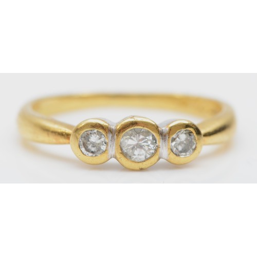 147 - An 18ct gold three stone brilliant cut diamond ring, collet set stone, M, 3gm