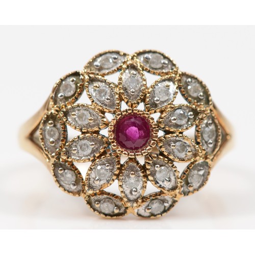 154 - A vintage gold ruby and brilliant cut diamond floral dress ring, P-Q, unmarked, 3.8gm.