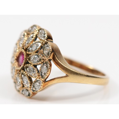 154 - A vintage gold ruby and brilliant cut diamond floral dress ring, P-Q, unmarked, 3.8gm.