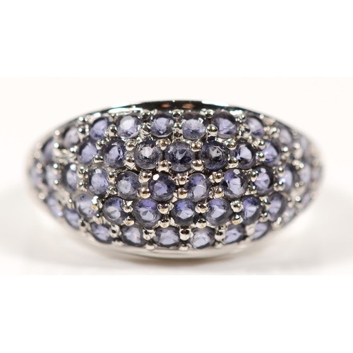 155 - A 9ct white gold tanzanite cluster ring, M, 3.6gm.