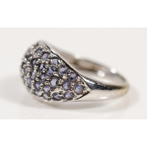 155 - A 9ct white gold tanzanite cluster ring, M, 3.6gm.