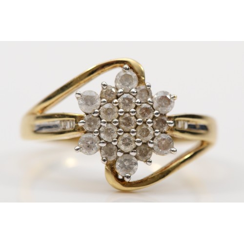 163 - A 9ct gold brilliant cut diamond floral cluster ring, with baguette cut diamonds to the shoulders, S... 