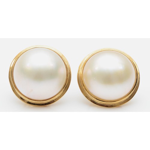 169 - A pair of 375 gold mounted mabe pearl ear studs, 15mm