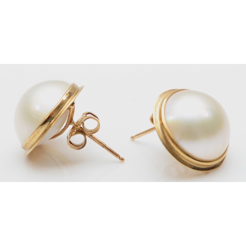 169 - A pair of 375 gold mounted mabe pearl ear studs, 15mm