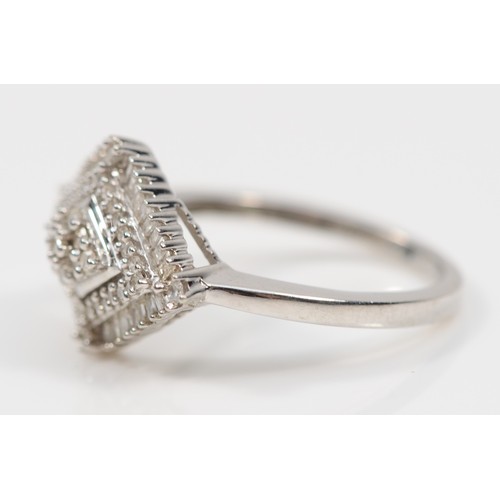 171 - A 9ct white gold diamond cluster ring, the rhombus shaped setting set with baguette cut and eight cu... 