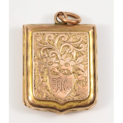 174 - An Edward VII 9ct gold shield shaped locket, by Albert Jackson, Birmingham 1903, with chased foliate... 