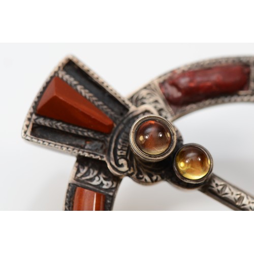 175 - A Victorian Scottish silver penannular brooch, c.1872, set with moss agate, blood stone and foil bac... 