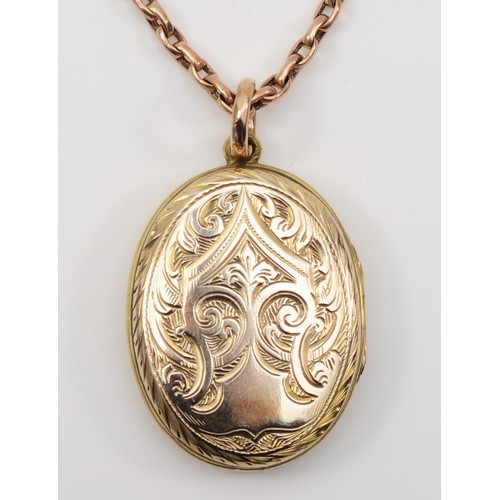 180 - A Victorian gold front and backed enamel oval locket, 31 x 22mm, unmarked, with a 9ct gold chain, ch... 