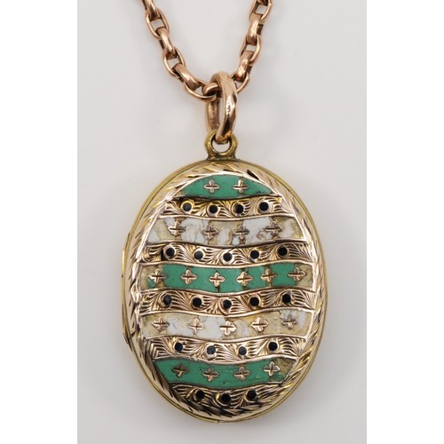 180 - A Victorian gold front and backed enamel oval locket, 31 x 22mm, unmarked, with a 9ct gold chain, ch... 