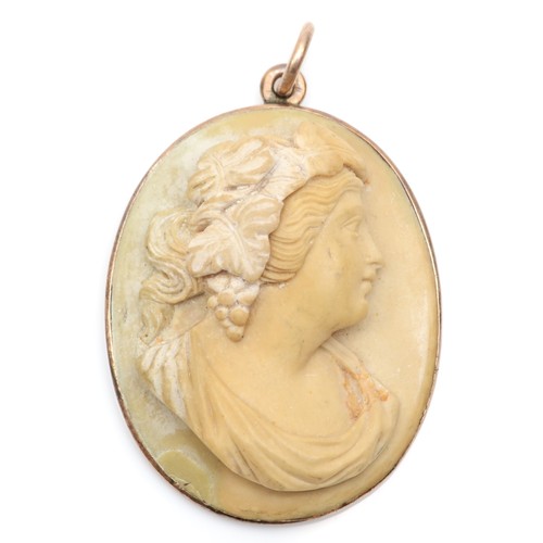 188 - A Victorian low carat gold mounted lava cameo pendant, carved to a Bacchante, plain mount, 30 x 24mm