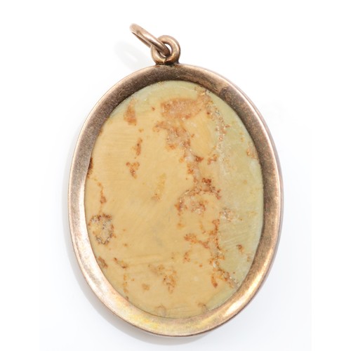 188 - A Victorian low carat gold mounted lava cameo pendant, carved to a Bacchante, plain mount, 30 x 24mm