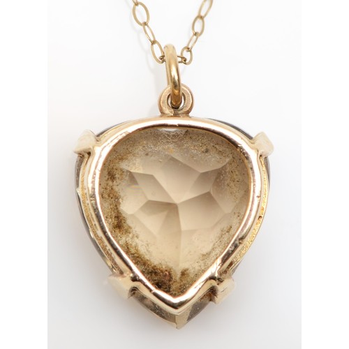 189 - A Scottish 9ct gold and citrine heart shape pendant, Edinburgh 1965, 15 x 14mm, later 9ct chain