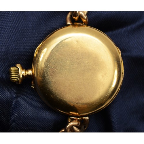 213 - D.F & C. , an early 20th century French 18k gold cased key less wind ladies wrist watch, enameled di... 