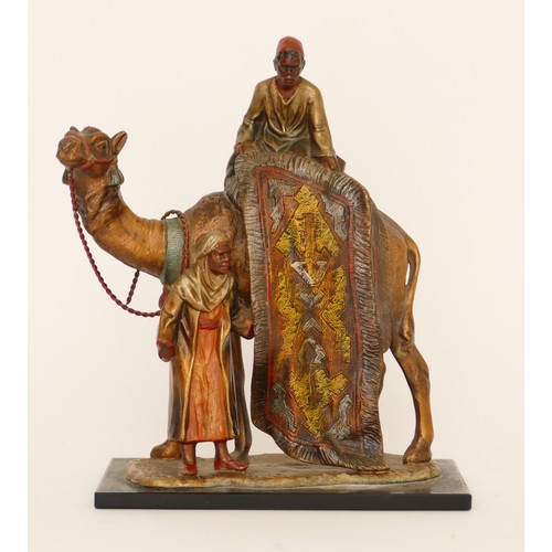 229 - A cold painted spelter table lighter of two Arab gentlemen selling carpets on the back of a camel, i... 