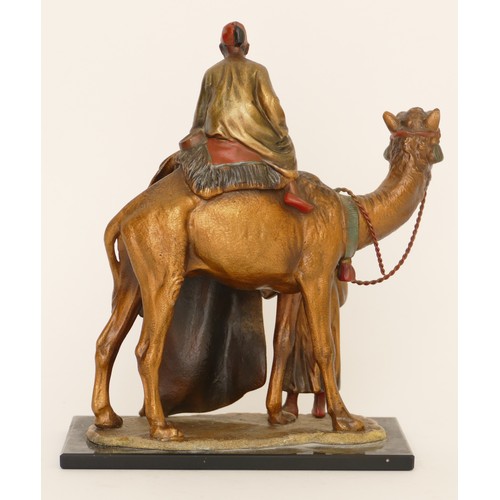 229 - A cold painted spelter table lighter of two Arab gentlemen selling carpets on the back of a camel, i... 