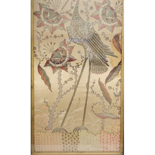 247 - A 20th century silk stump work style embroidery of a standing crane amongst flowers, 95x46cm, framed... 