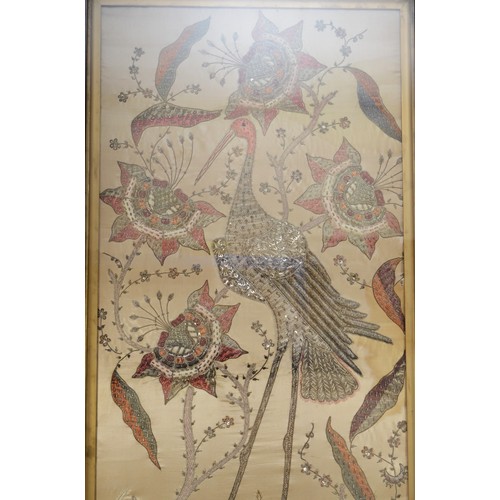 247 - A 20th century silk stump work style embroidery of a standing crane amongst flowers, 95x46cm, framed... 