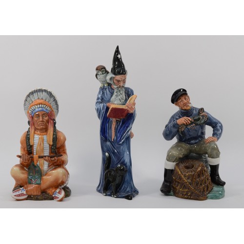 253 - Royal Doulton; three porcelain figures The Chief HN2892, The Wizard HN2877 and The Lobster Man HN231... 