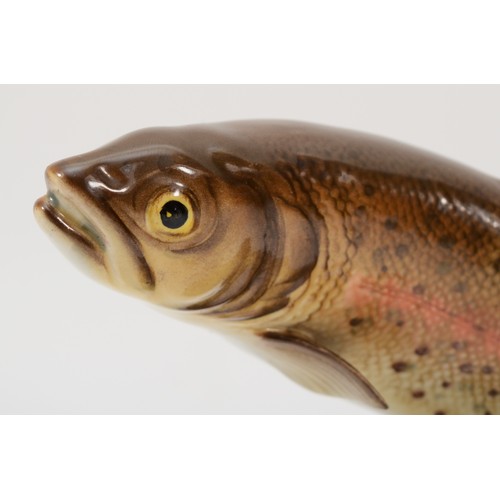 264 - Beswick; a painted porcelain trout, impressed 1032 and black marks to base, 17cm high.