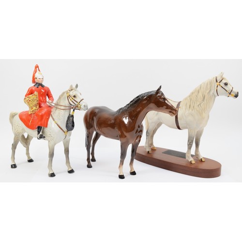 265 - Beswick; three 20th century porcelain horses comprising of Connoisseur model of Champion, Welsh Moun... 