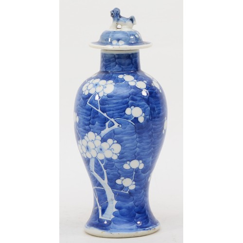 280 - A late 19th/early 20th century Chinese blue and white porcelain vase and cover decorated with Prunus... 