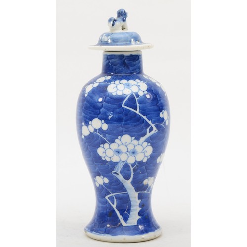 280 - A late 19th/early 20th century Chinese blue and white porcelain vase and cover decorated with Prunus... 