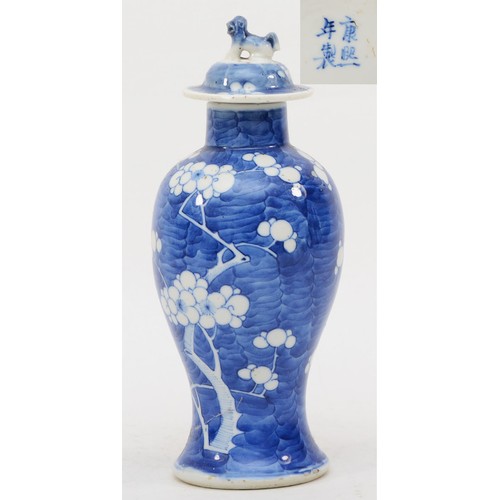 280 - A late 19th/early 20th century Chinese blue and white porcelain vase and cover decorated with Prunus... 