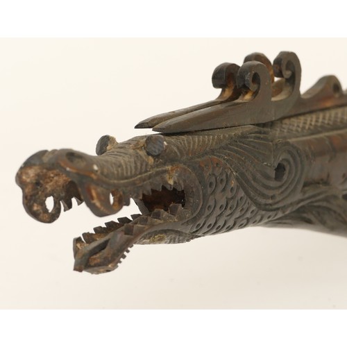 285 - A Chinese carved and incised resin ceremonial staff in the form a dragon, 85cm long