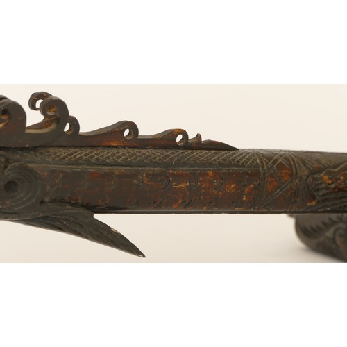 285 - A Chinese carved and incised resin ceremonial staff in the form a dragon, 85cm long