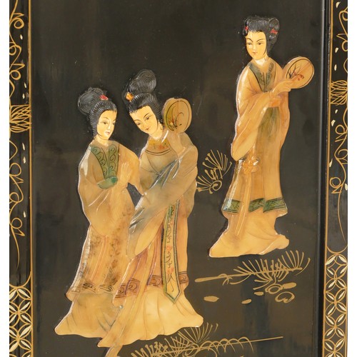 286 - An early 20th century Chinese lacquer panel decorated with applied three Chinese ladies standing in ... 