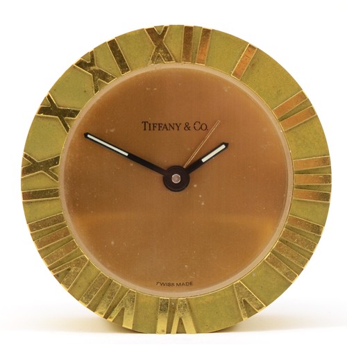 296 - Tiffany & Co, a 20th century brass cased circular desk alarm clock, impressed number 205369 verso, 6... 