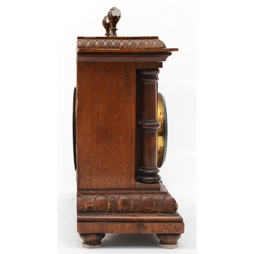 297 - An early 20th century beech cased desktop barometer/clock with applied thermometer, with carrying ha... 