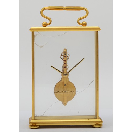 298 - Jaeger LeCoutre, a 20th century gilt brass cased  gilt brass cased mystery clock, raised on four bun... 