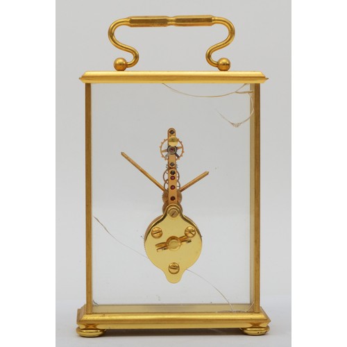 298 - Jaeger LeCoutre, a 20th century gilt brass cased  gilt brass cased mystery clock, raised on four bun... 