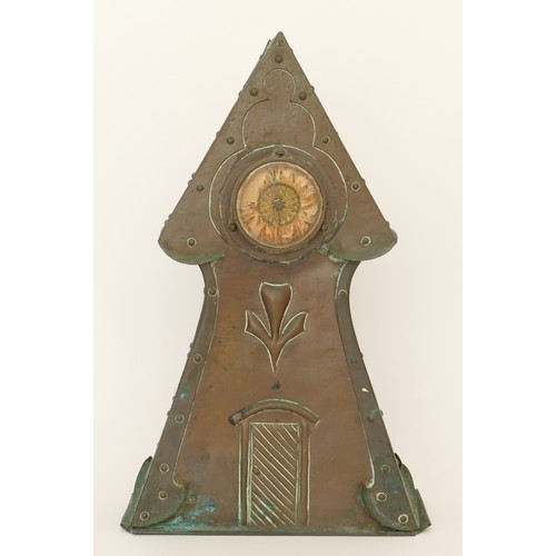 300 - An Arts & Crafts period hammered copper cased architectural tower mantle clock, raised on plinth bas... 