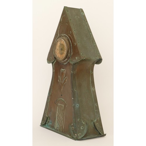 300 - An Arts & Crafts period hammered copper cased architectural tower mantle clock, raised on plinth bas... 