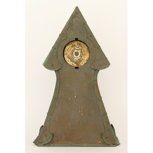 300 - An Arts & Crafts period hammered copper cased architectural tower mantle clock, raised on plinth bas... 