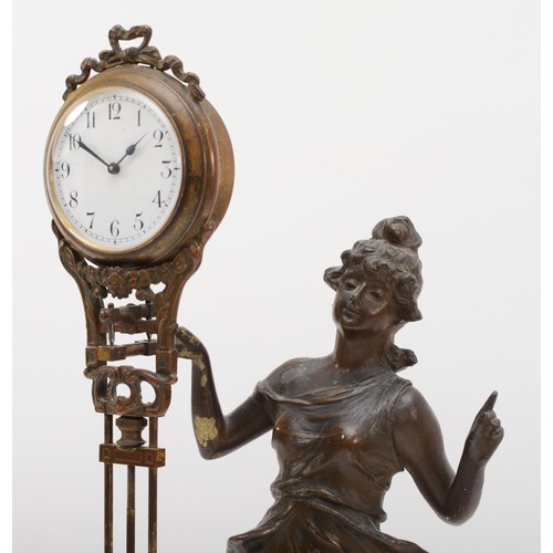 305 - A 20th century novelty bronzed spelter mystery clock in the form of a classical maiden, raised on ci... 