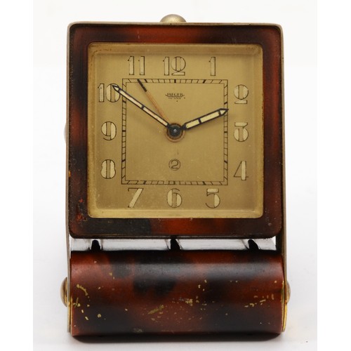 315 - Jaeger, an Art Deco brass tortoiseshell effect folding travelling alarm clock, the dial with Arabic ... 