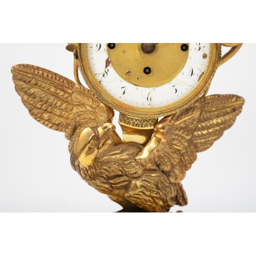 316 - A 19th century gilt brass striking and calendar mantle clock, the white enamel chapter ring with bla... 