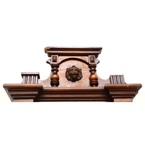 317 - A walnut veneered Vienna style wall clock, late 19th century, the cornice mounted with the head of a... 