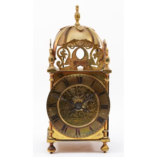 318 - A brass lantern clock, early 20th century, striking on a bell, with pierced fretwork decoration, the... 