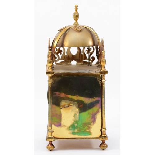 318 - A brass lantern clock, early 20th century, striking on a bell, with pierced fretwork decoration, the... 