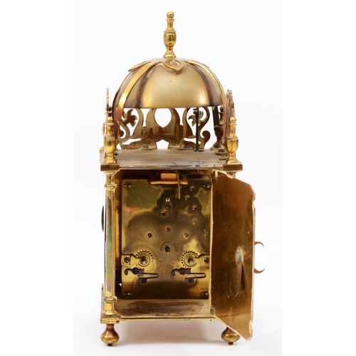 318 - A brass lantern clock, early 20th century, striking on a bell, with pierced fretwork decoration, the... 